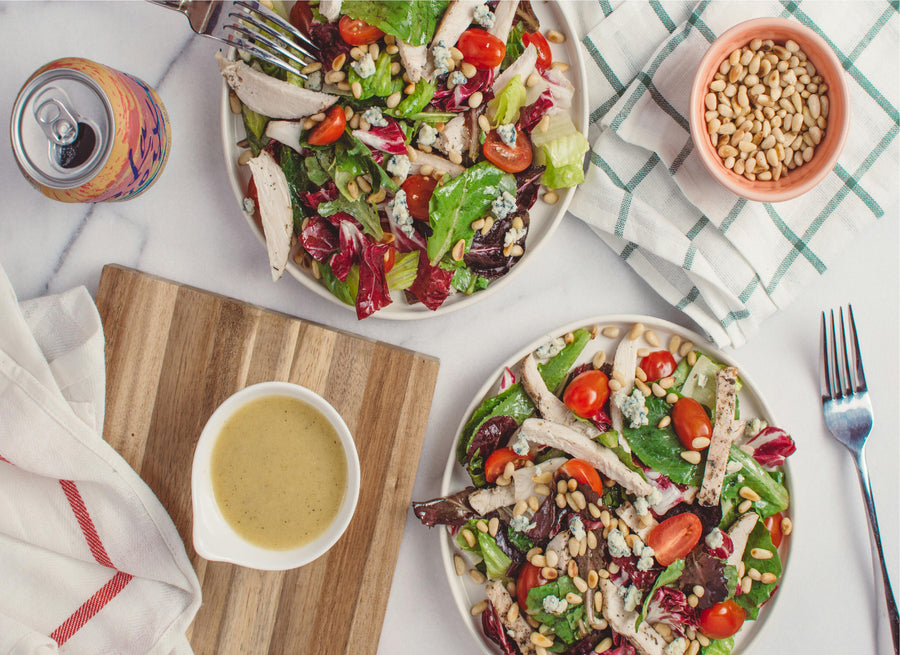 Fresh salad with vegetables and nuts served with easy pistachio butter salad dressing