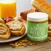 Nuttinosh roasted pistachio butter with toast, fruit, pastries, and pistachios