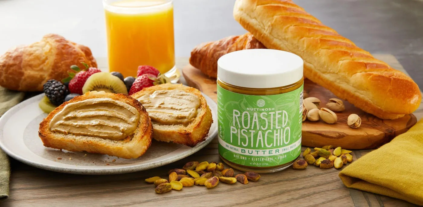 Nuttinosh roasted pistachio butter with toast, fruit, pastries, and pistachios