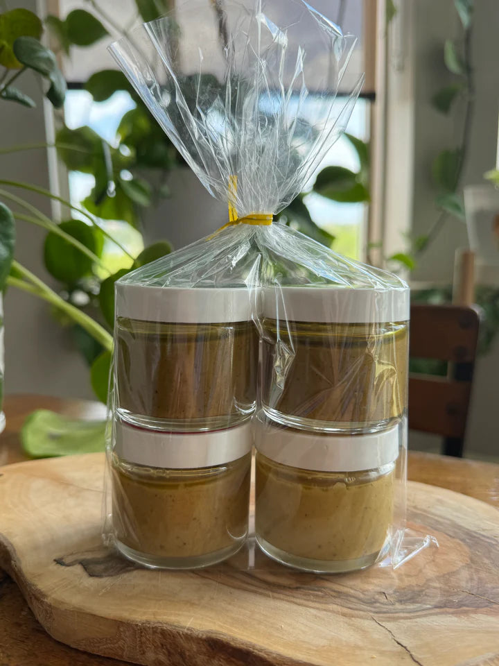 Nuttinosh Roasted and Sea Salt pistachio butter jars arranged as a giftable wholesale bundle