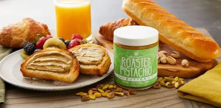 Nuttinosh Roasted Pistachio Butter with toast, fruit, pastries, and pistachios