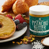 Nuttinosh Pistachio Butter with Sea Salt served with toast, fruit, and pistachios